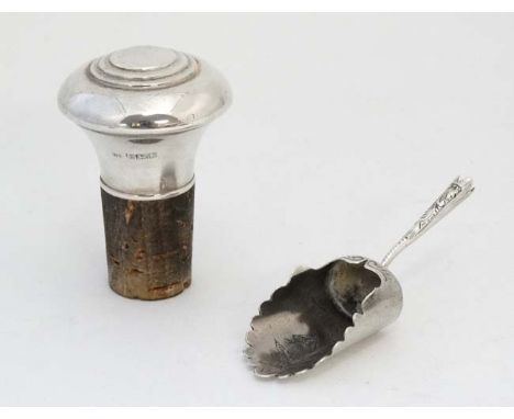 A silver caddy spoon of shovel form 3" long Hallmarked Birmingham 1900 together with a silver topped bottle stopper hallmarke