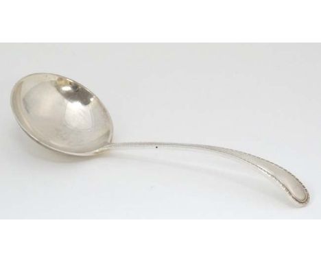 A silver sauce ladle with feather edge handle hallmarked Birmingham 1966 maker  Joseph Gloster Ltd. 5" long  CONDITION: Pleas