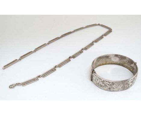 A hallmarked silver bangle formed bracelet with engraved acanthus scroll decoration together with a Rennie Mackintosh inspire