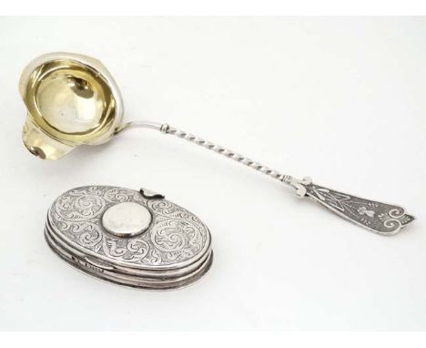 A white metal ladle with gilded bowl together with a Victorian silver oval box hallmarked London 1989 (2) 2 3/4" wide  CONDIT