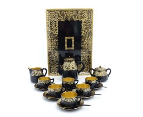 A Japanese gilt and lacquer decorated teaset comprising teapot 6 cups, saucers, sucrier, milk pot, teaspoons and teapot. Appr