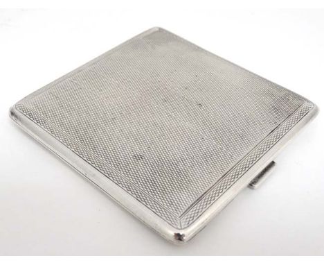 A silver cigarette case with engine turned decoration. Hallmarked Birmingham 1927 maker Adie Bros Ltd.  3 1/2" x 3 1/4" (108g