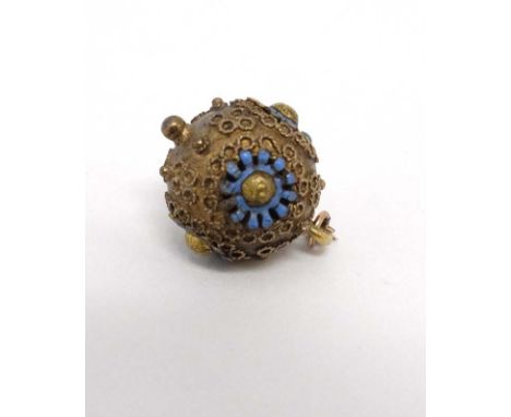 A gilt metal sphere formed pendant with enamel decoration. Approx ½” diameter  CONDITION: Please Note -  we do not make refer