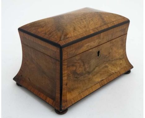 A Victorian burr walnut cross banded concave 2 division tea caddy on squat bun feet.  8 1/4" wide x 5 1/2" deep x 5" high  CO
