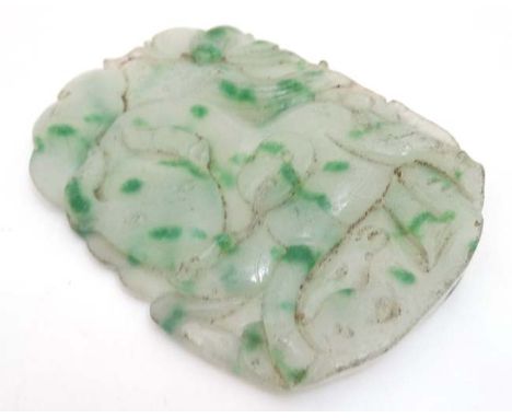 A carved large jade pendant having a Kylin? to one side and a bull to the other. 6 1/2" x 4 6/8"  CONDITION: Please Note -  w