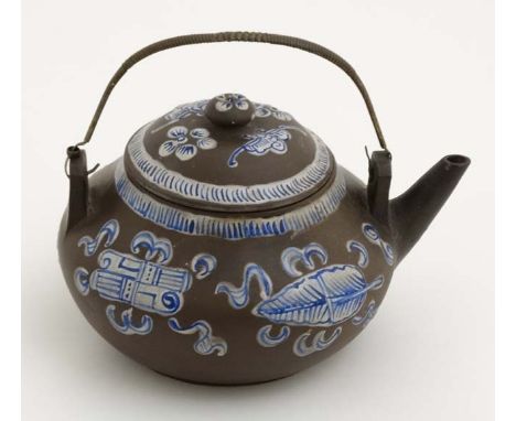 A Chinese Yixing style studio pottery matte brown teapot with lid having blue and white enamel decoration , signed to base an