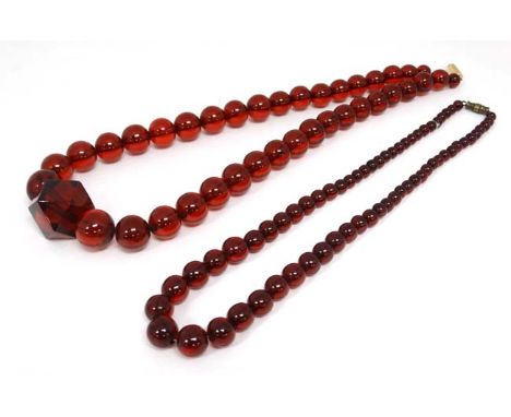 2 Vintage necklaces of graduated cherry amber coloured beads. 20" long and 17" long  CONDITION: Please Note -  we do not make