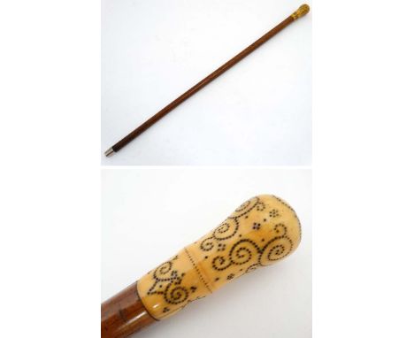 An 18thC walking stick with ivory piquet work handle, malalaca shaft and later white metal ferrule 33 1/2" long  CONDITION: P