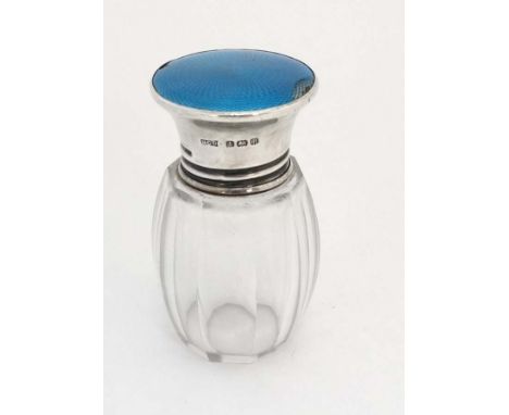 A glass salts / scent bottle with silver top having turquoise guilloché enamel decoration. Hallmarked Birmingham 1926 maker H