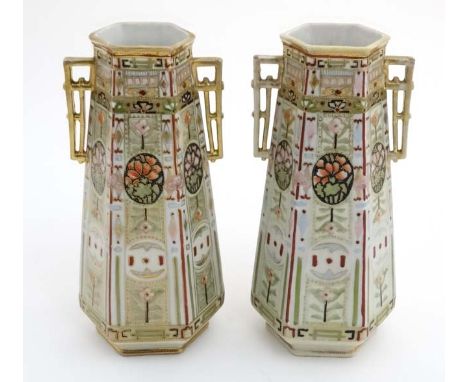 A pair of Noritake , Made in Japan, Art Deco twin handled vases , decorated with stylised flowers in shades of green , red an