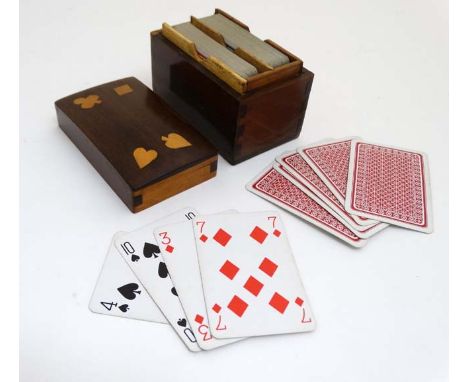 A 19thC inlaid card box, the top with the 4 suits inlaid to lid opening to reveal 2 playing card packs 4 1/2" wide  CONDITION