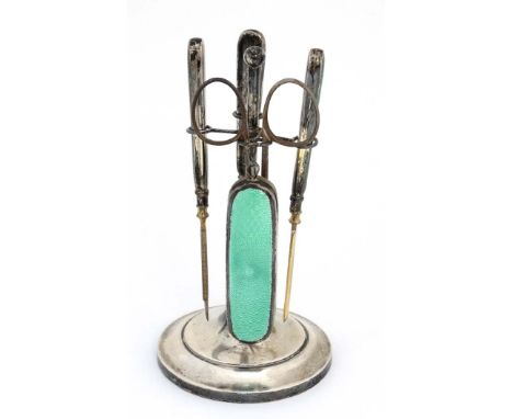 A silver manicure stand  with various manicure tools. Birmingham 1929/30 maker Barker Brothers Silver Ltd. 5" high  CONDITION