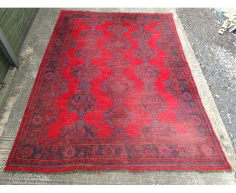 Carpet / Rug: a Turkish woollen carpet, formerly from Brasenose College , Oxford with reds, blues and green colours , 110" wi