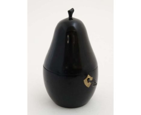 Kitchenalia : A late 20thC / early 21stC novelty tea caddy formed as a pear with ebonised finish. Approx 7" high  CONDITION: 