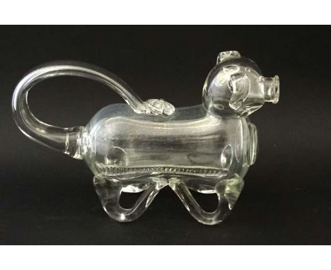 An early 20thC novelty glass claret jug / decanter in the form of a dog  approx 10 1/2" long  CONDITION: Please Note -  we do