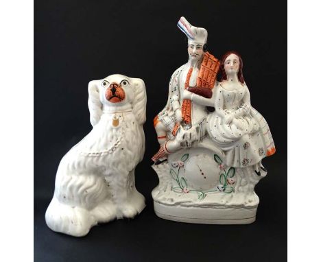 A 19thC Staffordshire flat back clock figure group , modelled as a Scottish couple. 13 1/2'' high. Together with a Staffordsh