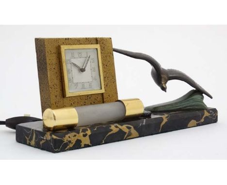 Art Deco bedside light and clock : a French marble base with swooping sea bird and wind up clock having electric light  for n