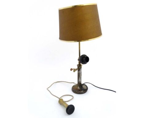 An old electric lamp formed form a candlestick telephone with shade. Approx 25 1/2" high   CONDITION: Please Note -  we do no