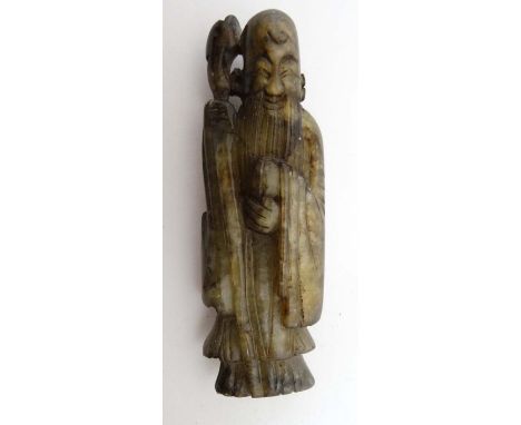 A 19thC black and grey jade figure of Shou ( the god of longevity) 3 5/8" high  CONDITION: Please Note -  we do not make refe