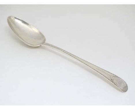 A rare Old English Pattern table spoon with bright cut decoration. Hallmarked London 1785 with Incuse duty mark and partial D