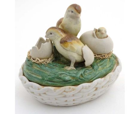 Kitchenalia :   A late 20thC ceramic novelty egg basket and cover, the top decorated with hatching chicks . The whole 7 1/2" 