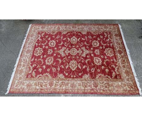 Carpet / Rug : a red ground Ziegler style carpet  measuring 79 x 114" CONDITION: Please Note -  we do not make reference to t
