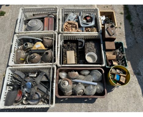 An autojumbler's lot in eight boxes of various parts including sealed beam units, light clusters etc. plus a tub of bearings 