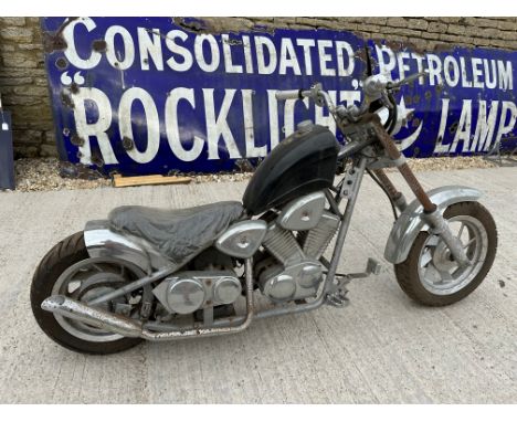 A 49cc child's motorbike in the style of a Harley Davidson.