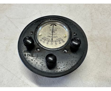 A Smiths combined amp meter and light switch panel.
