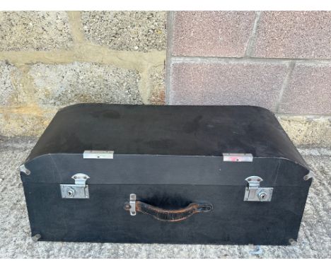 A sloping fronted and backed car trunk.