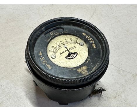 A Smiths bezel ammeter and light switch, to suit Bentley 3-litre.