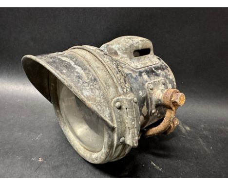 A Miller Model no. 23A motorcycle headlamp.