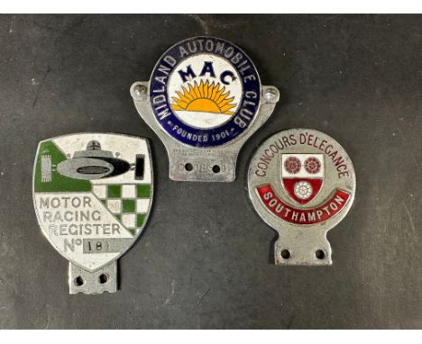 A Midland Automobile Club enamel badge, a Motor Racing Register enamel car badge, no. 181 and a third for Concours D'Elegance