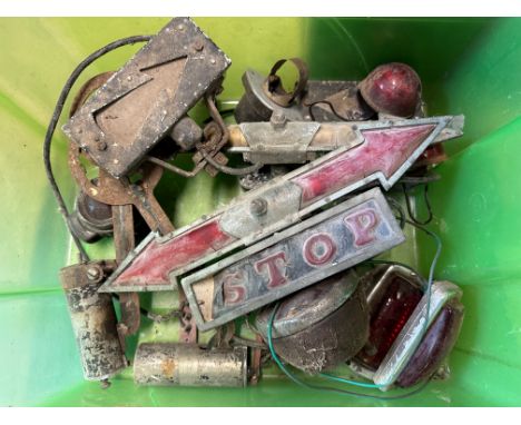 A box of various parts including rear lights, windscreen mounted 'illuminated arrow' indicators etc., mostly 1920s and 1930s.