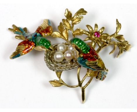 A stunning 18ct gold brooch featuring enamelled birds with cultured pearl eggs and a ruby set into the centre of a flower, W.