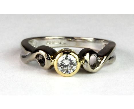 An 18ct yellow and white gold solitaire diamond ring (approx. 0.20ct, Est. Colour E/F, clarity VS) (I.5).
