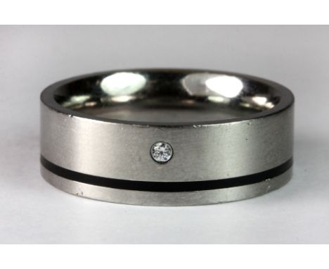 A gentleman's diamond set titanium ring (X).