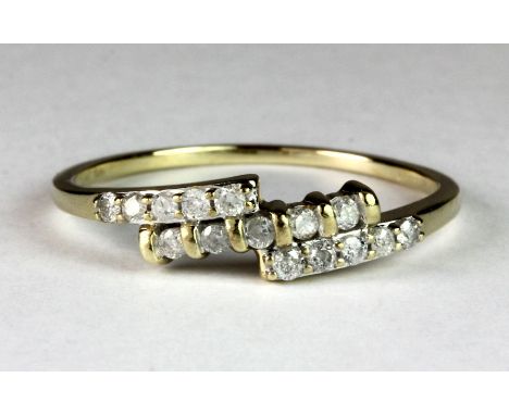 A 9ct gold three row diamond set dress ring (S).