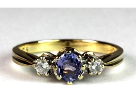 A 9ct gold diamond and tanzanite set ring, (L).