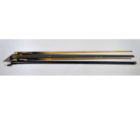 Two vintage snooker cues.