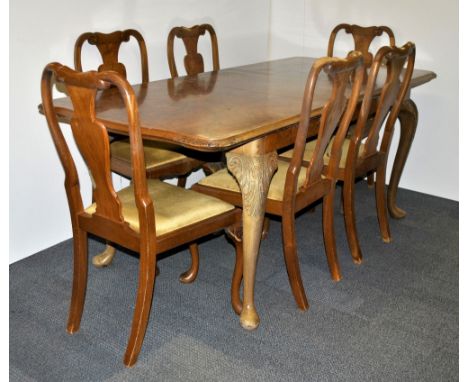 Vintage walnut extending dining table and six chairs.