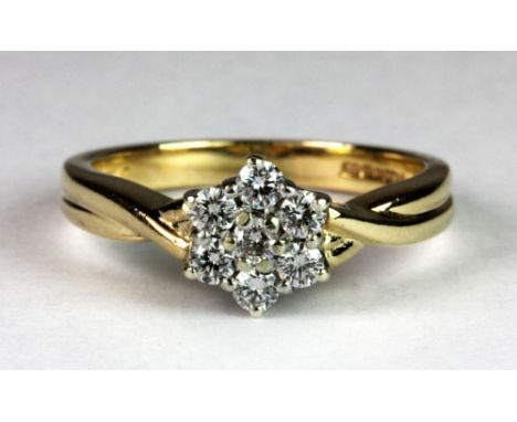 A 9ct yellow and white gold diamond flower cluster ring, (approx. 0.30ct diamonds) (N).