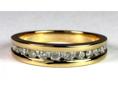 A 9ct gold diamond half eternity ring, (approx. 0.50ct diamonds) (N.5).