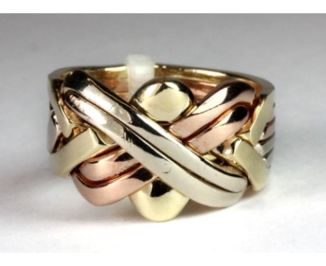 A heavy 9ct three colour gold gentleman's puzzle ring (P).