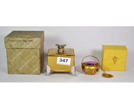 A vintage Kigu musical jewellery casket, H. 8.5 cm, and a Kigu flower basket compact.