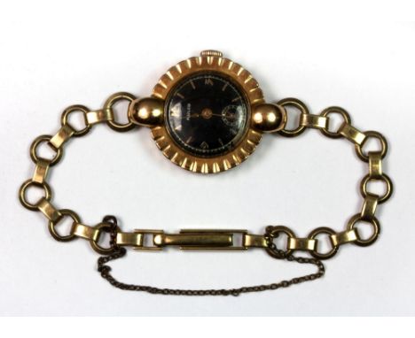 A ladies vintage 18ct gold Mulco wristwatch on a 9ct gold strap.