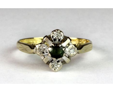 An 18ct yellow and white gold green stone and diamond flower shape ring (K.5).