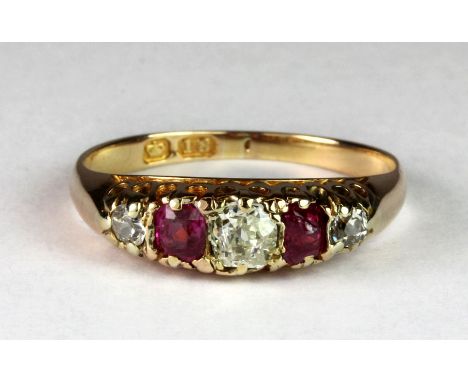 A lovely 18ct gold Victorian ring set with ruby and diamonds and a large centre old cut champagne diamond.