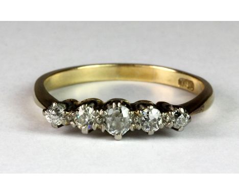 An 18ct yellow gold ring set with five diamonds (P).