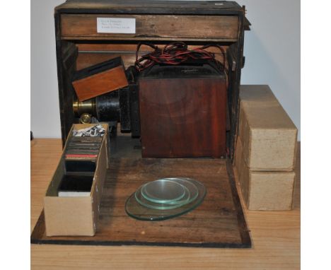 Boxed magic lantern with three boxes of hand tinted glass story slides.